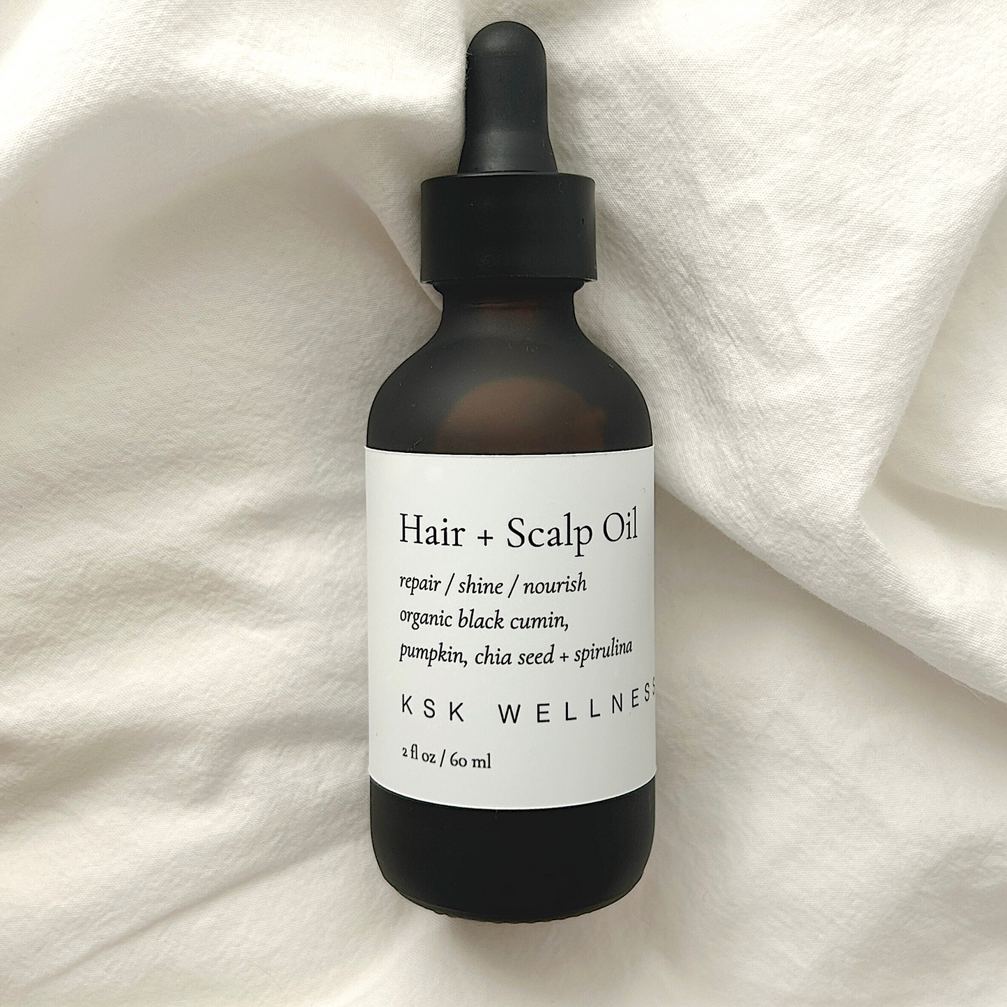 Nourishing hair + scalp oil for all hair types with a blend of argan oil, marula oil and chia seed oil. Handcrafted with a blend of organic fair trade botanical oils is high in antioxidants, essential fatty acids, and amino acids that is effective at relieving dry itchy scalp, keeping hair shiny, soft, supple, and moisturized.